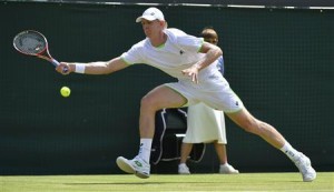 Kevin Anderson of South Africa hits a return to Tomas Berdych of the Czech Republic during their men's singles tennis match at the Wimbledon Tennis Championships, in London