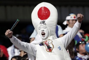A Japan fan cheers before their 2010 World Cup Group E soccer match against Cameroon at Free State stadium in Bloemfontein