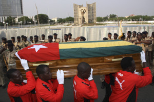 Pallbearers carry the coffin with the remains Togolese assistant soccer coach Abalo during the funeral service in front of Congress Palace in the capital Lome