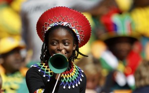 A soccer fan blows a vuvuzela while awaiting the start of the opening ceremony of the 2010 World Cup at Soccer City stadium in Johannesburg