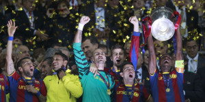 Barcelona players celebrate with the trophy after their Champions League final soccer match against Manchester United at Wembley Stadium in London