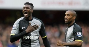 Tottenham Hotspur's Emmanuel Adebayor, left, celebrates his goal against Arsenal with teammate Jermain Defoe, during their English Premier League soccer match at Emirates stadium, London, Saturday, Nov. 17, 2012. (AP Photo/Sang Tan)