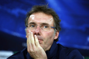Paris St Germain's coach Laurent Blanc attends a news conference before a training session in Lisbon