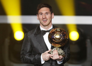 Messi of Argentina FIFA World Player of the Year 2012 holds his FIFA Ballon d'Or trophy during the FIFA Ballon d'Or 2012 soccer awards ceremony in Zurich