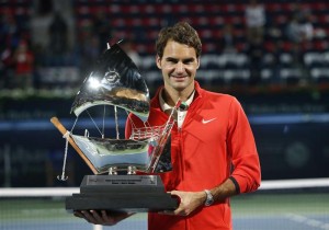 Roger Federer of Switzerland holds trophy after defeating Tomas Berdych of Czech Republic in men's singles final match at ATP Dubai Tennis Championships