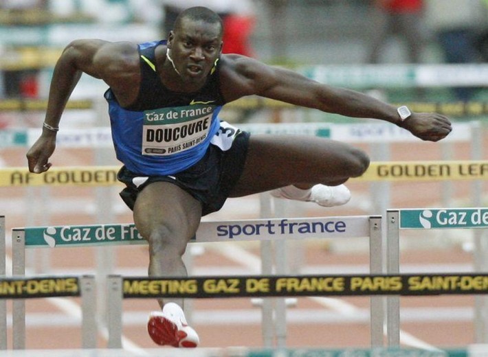 France's Ladji Doucoure competes in the men's 110m hurdles during the Paris Golden League meeting at the Stade de France in Saint Denis near Paris