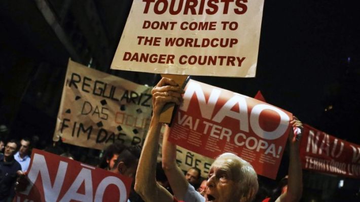 Demonstrators shout slogans during a protest against the 2014 World Cup, in Sao Paulo