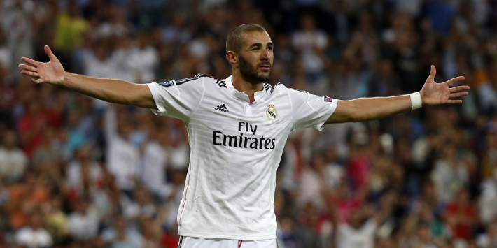 Real Madrid's Benzema celebrates after scoring a goal against Basel during their Champions League soccer match in Madrid