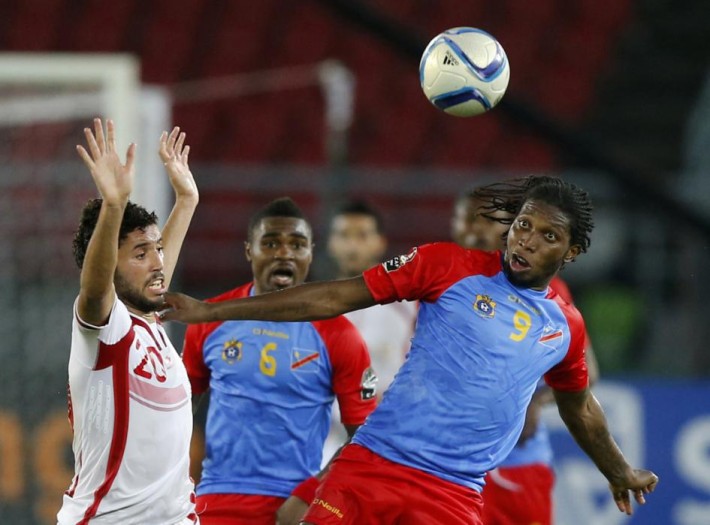 Democratic Republic of Congo's Dieumerci Mbokani challenges Tunisia's Mohamed Ali Yaakoubi during their Group B soccer match of the 2015 African Cup of Nations in Bata