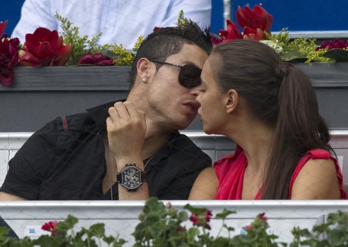 Real Madrid's Ronaldo and his girlfriend Shayk kiss during the men's semi-final match between Roger Federer and Janko Tipsarevic at the Madrid Open tennis tournament