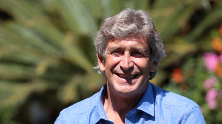 Main Manuel holding image