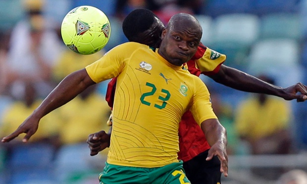 South Africa's Tokelo Rantie, foreground, is challenged by Angola's Dany Massunguna in their African Cup of Nations Group A soccer match at Moses Mabhida Stadium in Durban, South Africa, Wednesday, Jan. 23, 2013. (AP Photo/Rebecca Blackwell)
