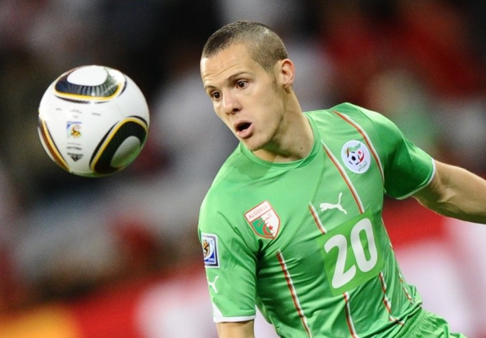 Algeria's defender Djamel Mesbah eyes the ball during the 2010 World Cup group C first round football match between England and Algeria on June 18, 2010 at Green Point stadium in Cape Town. The match ended in a 0-0 draw. NO PUSH TO MOBILE / MOBILE USE SOLELY WITHIN EDITORIAL ARTICLE - AFP PHOTO / JEWEL SAMAD (Photo credit should read JEWEL SAMAD/AFP/Getty Images)