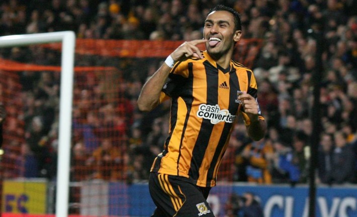 Hull City's Egyptian midfielder Ahmed Elmohamady celebrates scoring the opening goal of the English Premier League football match between Hull City and Fulham at the KC Stadium in Hull on December 28, 2013. AFP PHOTO / LINDSEY PARNABY RESTRICTED TO EDITORIAL USE. No use with unauthorized audio, video, data, fixture lists, club/league logos or live services. Online in-match use limited to 45 images, no video emulation. No use in betting, games or single club/league/player publications.LINDSEY PARNABY/AFP/Getty Images