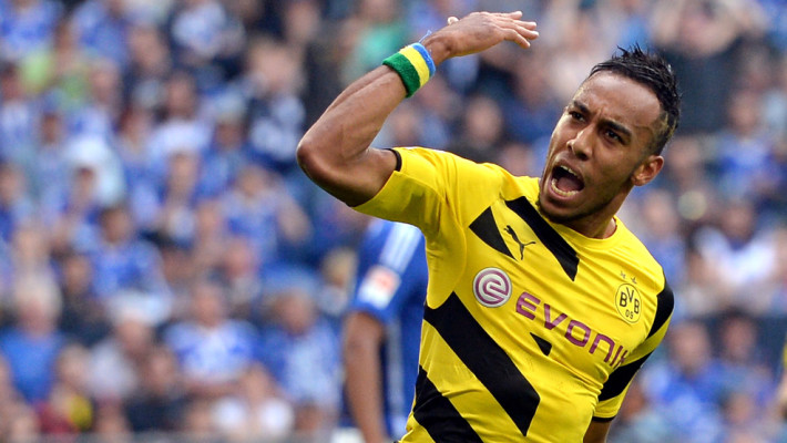GELSENKIRCHEN, GERMANY - SEPTEMBER 27: Pierre-Emerick Aubameyang of Dortmund celebrates his team's first goal during the Bundesliga match between FC Schalke 04 and Borussia Dortmund at Veltins Arena on September 27, 2014 in Gelsenkirchen, Germany. (Photo by Sascha Steinbach/Bongarts/Getty Images)