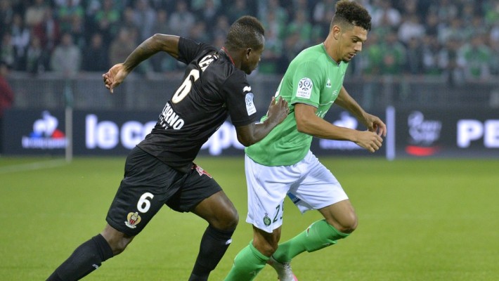 Nice's Ivorian midfielder Jean Michel Seri (L) vies with Saint-Etienne's French defender Kevin Malcuit during the French L1 football match between Saint-Etienne (ASSE) and Nice (OGCN) at Geoffroy Guichard Stadium in Saint-Etienne, central France, on September 27, 2015. AFP PHOTO / JEAN-PHILIPPE KSIAZEK (Photo credit should read JEAN-PHILIPPE KSIAZEK/AFP/Getty Images)