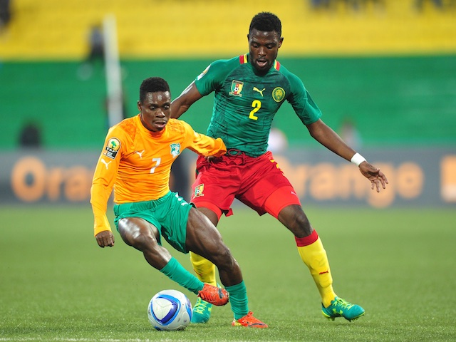 Djobo Atcho of Ivory Coast controls the ball as he is challenged by Joseph Ngwem of Cameroon during the 2016 CHAN Rwanda quarterfinal between Cameroon and Ivory Coast at Huye Stadium, Butare on 30 January 2016 ©Ryan Wilkisky/BackpagePix