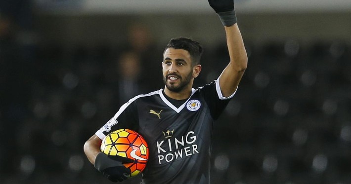 Football Soccer - Swansea City v Leicester City - Barclays Premier League - Liberty Stadium - 5/12/15
Leicester City's Riyad Mahrez celebrates with the match ball after the game after scoring a hat trick
Action Images via Reuters / Paul Childs
Livepic
EDITORIAL USE ONLY. No use with unauthorized audio, video, data, fixture lists, club/league logos or "live" services. Online in-match use limited to 45 images, no video emulation. No use in betting, games or single club/league/player publications. Please contact your account representative for further details. - RTX1XC0L