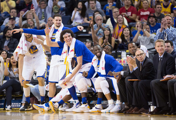 Mar 16, 2016; Oakland, CA, USA; Golden State Warriors bench celebrate in the final minutes of the game against the New York Knicks during the fourth quarter at Oracle Arena. The Warriors defeated the Knicks 121-85. Mandatory Credit: Kelley L Cox-USA TODAY Sports