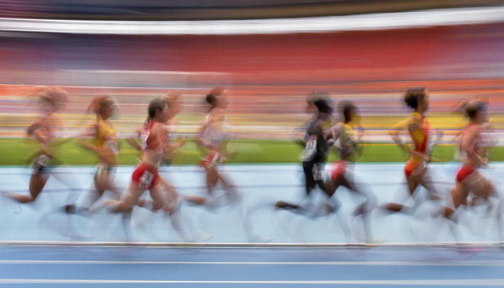 Athletes compete in a women's 5000-meter heat at the World Athletics Championships in the Luzhniki stadium in Moscow, Russia, Wednesday, Aug. 14, 2013. (AP Photo/Martin Meissner)