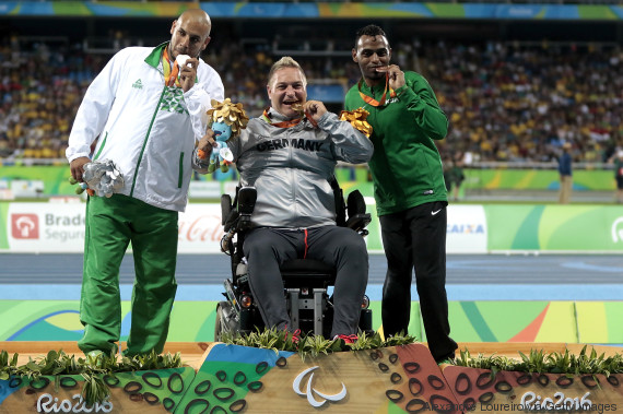 RIO DE JANEIRO, BRAZIL - SEPTEMBER 10: (L-R) Silver medalist Kamel Kardjena of Algeria , Gold medalist Daniel Scheil of Germany and Bronze medalist Hani Alnakhli of Saudi Arabia celebrate on the podium at the medal ceremony for the Menâs Shot Put â F33 Final during day 3 of the Rio 2016 Paralympic Games at the Olympic Stadium on September 9, 2016 in Rio de Janeiro, Brazil. (Photo by Alexandre Loureiro/Getty Images)