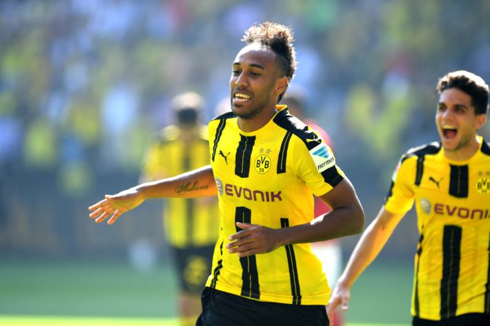 Dortmund's Gabonese striker Pierre-Emerick Aubameyang celebrates after scoring the 1-0 during the German first division Bundesliga football match of Borussia Dortmund vs FSV Mainz 05 in Dortmund, western Germany, on August 27, 2016. / AFP PHOTO / PATRIK STOLLARZ / RESTRICTIONS: DURING MATCH TIME: DFL RULES TO LIMIT THE ONLINE USAGE TO 15 PICTURES PER MATCH AND FORBID IMAGE SEQUENCES TO SIMULATE VIDEO. == RESTRICTED TO EDITORIAL USE == FOR FURTHER QUERIES PLEASE CONTACT DFL DIRECTLY AT + 49 69 650050
